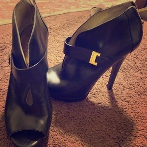 Michael Kors Black heels with gold buckle